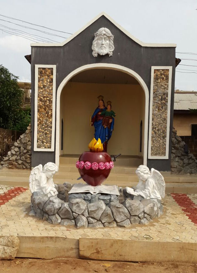 Artist molding clay bust sculpture in studio workshop Lagos