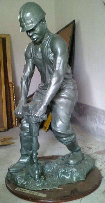 Cement relief wall sculpture with traditional African patterns